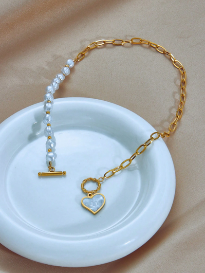 Shein 1pc Fashion Niche Design Stainless Steel Faux Pearl Chain Asymmetric Splice OT Buckle Collarbone Necklace With Heart Pendant>